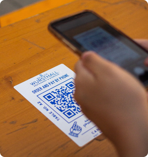 orange mobile phone or smartphone with barcode, qr code scanning